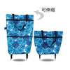 A blue floral patterned folding shopping trolley bag with black handles.