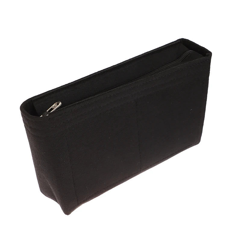 Black felt cosmetic bag insert organizer with a zipper closure.
