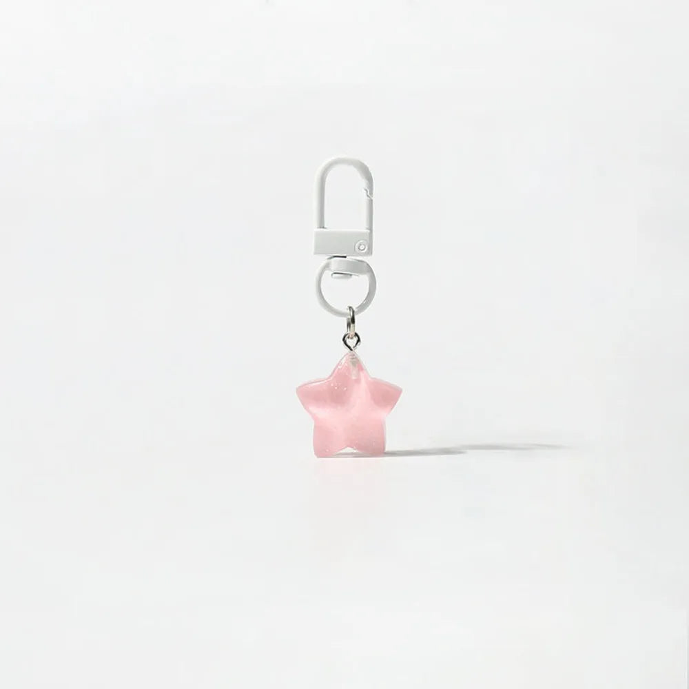 Silver necklace with a star pendant and a hook, displayed against a white background.