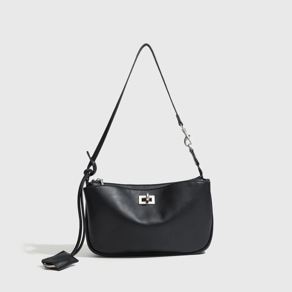 A black classic split leather shoulder tote bag with a long strap is shown against a light gray background.