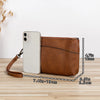 A brown retro PU leather zipper wrist bag next to a white smartphone, shown on a wooden surface.