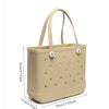 A beige portable EVA beach tote bag with a handle and perforated design.