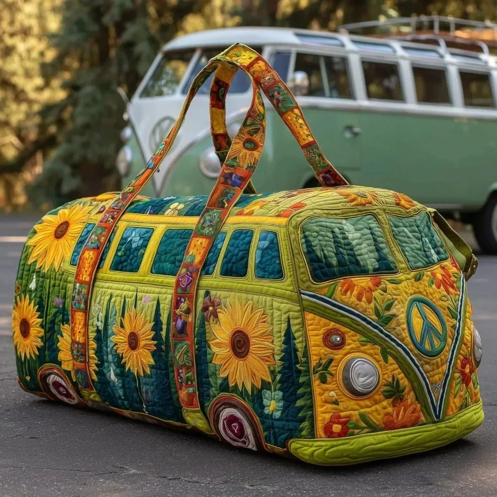 A quilted travel duffle bag decorated with colorful floral and nature patterns, resting on asphalt near a vintage van.
