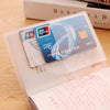 A triple pack of frosted clear card sleeves for ID and credit cards is shown resting on a wooden surface.