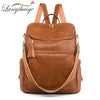 A brown leather backpack featuring a vintage tassel design and anti-theft features.