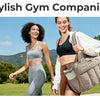 A woman carrying a stylish gym companion tote bag with an expandable pocket and laptop compartment in a park setting.