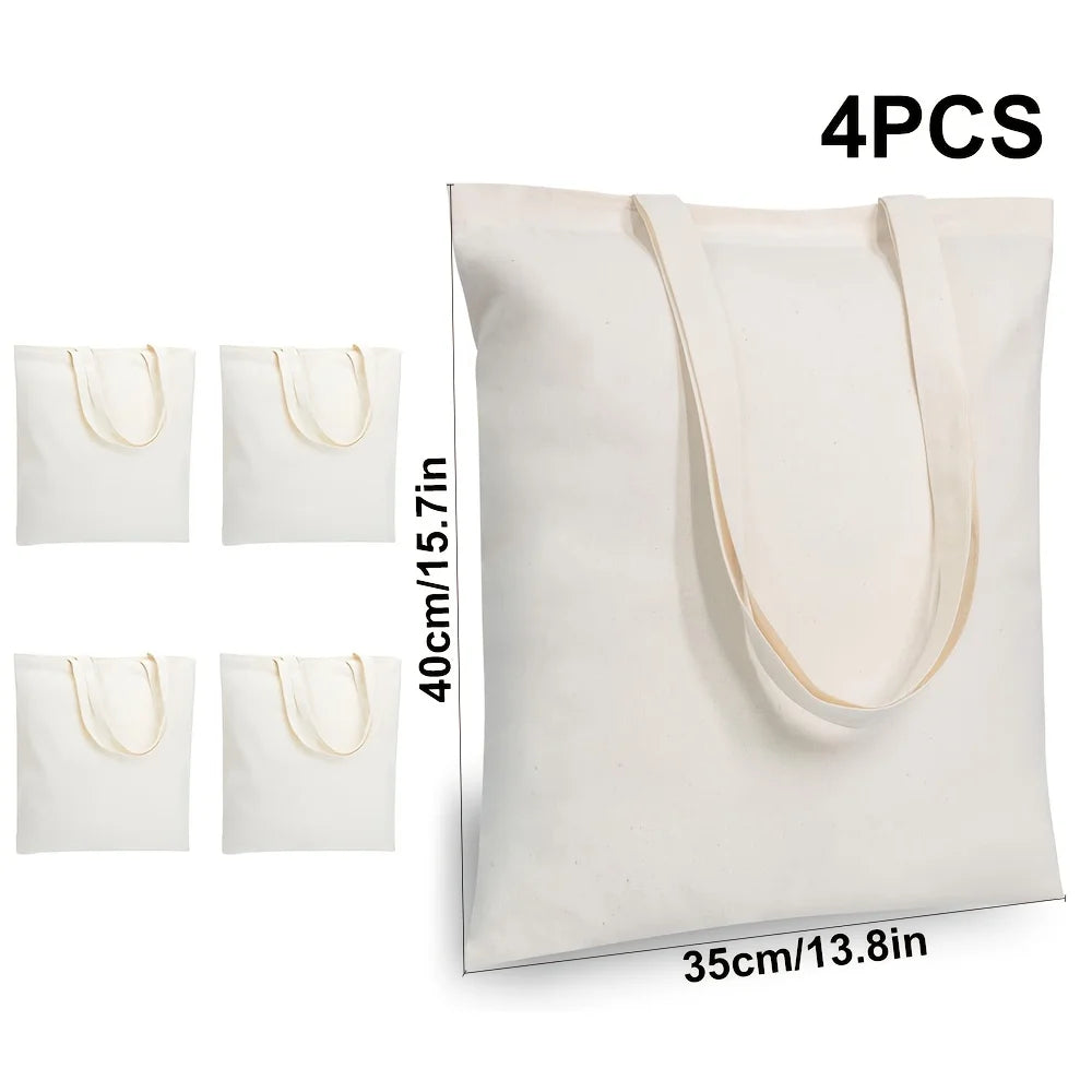 Quatre sacs en toile de coton blancs avec poignées beige clair, présentés verticalement.