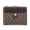 A dark brown leather folding wallet with a gold accent, featuring an all-over monogram pattern.