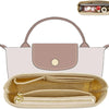 A light pink felt mini bag organizer pouch with a handle and a zippered interior pocket is shown alongside a larger beige can