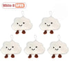 Five white cloud-shaped plush keychains or brooch pins