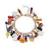A gold charm bracelet featuring Halloween-themed charms including a pumpkin, ghost, and other spooky elements.