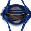 A deep blue leather handbag with a flap and interior pocket is shown open, revealing a zippered compartment.