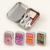 A portable metal storage box with a lid containing various sardine print designs.