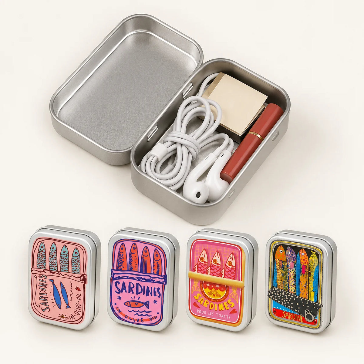 A portable metal storage box with a lid containing various sardine print designs.