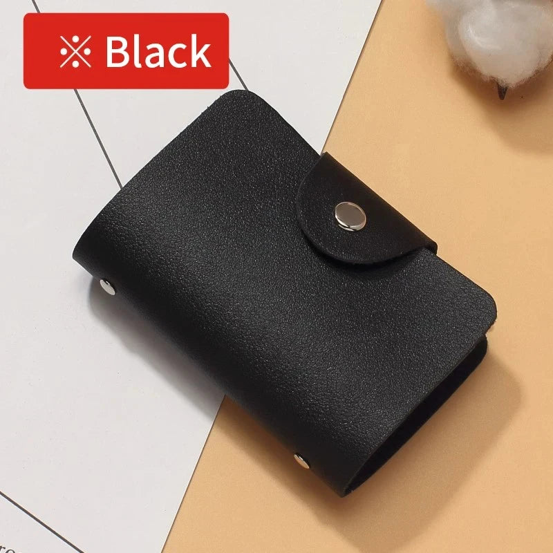 A black premium PU leather ID and credit card wallet shown lying on a light background.