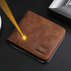 A brown leather zipper wallet with a gold engraving is shown on a dark surface.