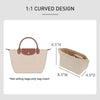 A light beige felt mini bag organizer pouch with a curved design and a brown leather accent.