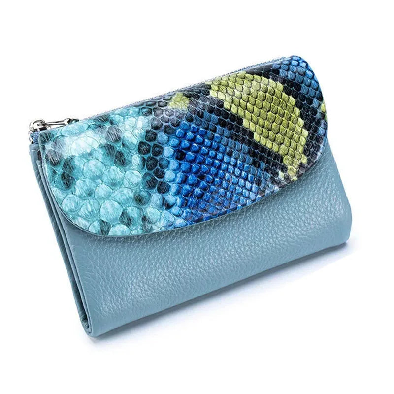 A genuine leather mini card holder wallet featuring a colorful snakeskin pattern on the flap.