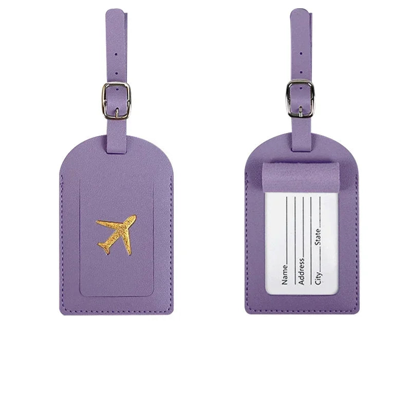Purple PU leather luggage tag with a gold airplane design and a white identification section.