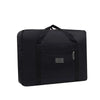 Black foldable travel duffel bag with a luggage strap visible on the top.