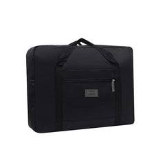 Black foldable travel duffel bag with a luggage strap visible on the top.