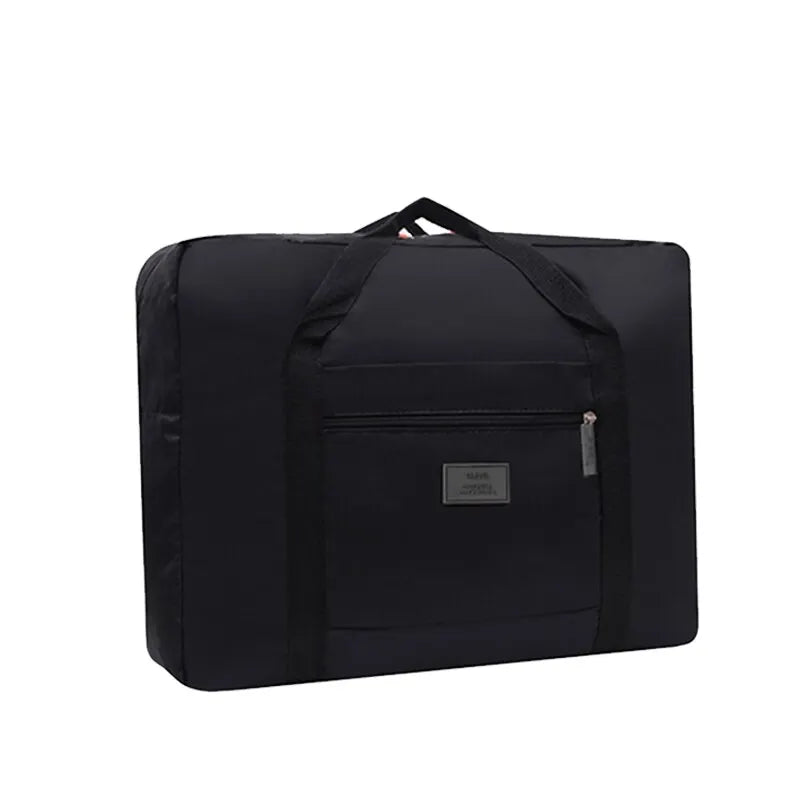 Black foldable travel duffel bag with a luggage strap visible on the top.