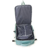 A dark blue compact travel backpack with a light green trim and straps, shown open.