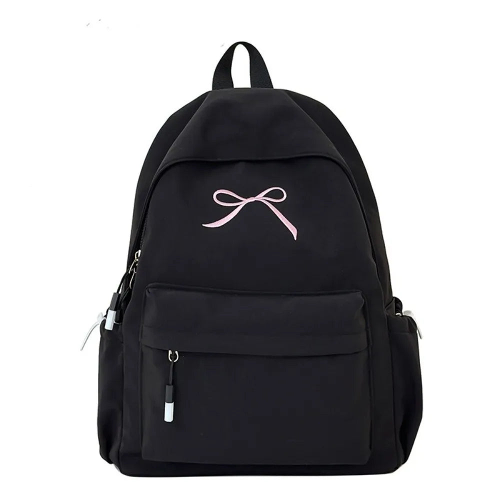 Black portable embroidered backpack for students with a pink ribbon detail