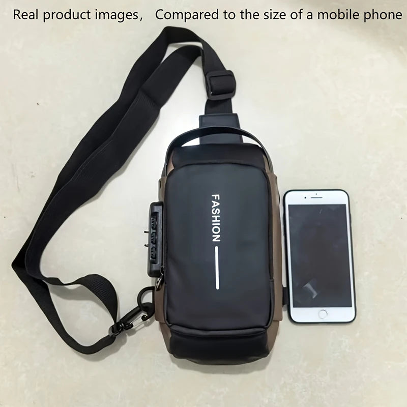 A black durable men's oxford sling bag is shown next to a smartphone for scale comparison.