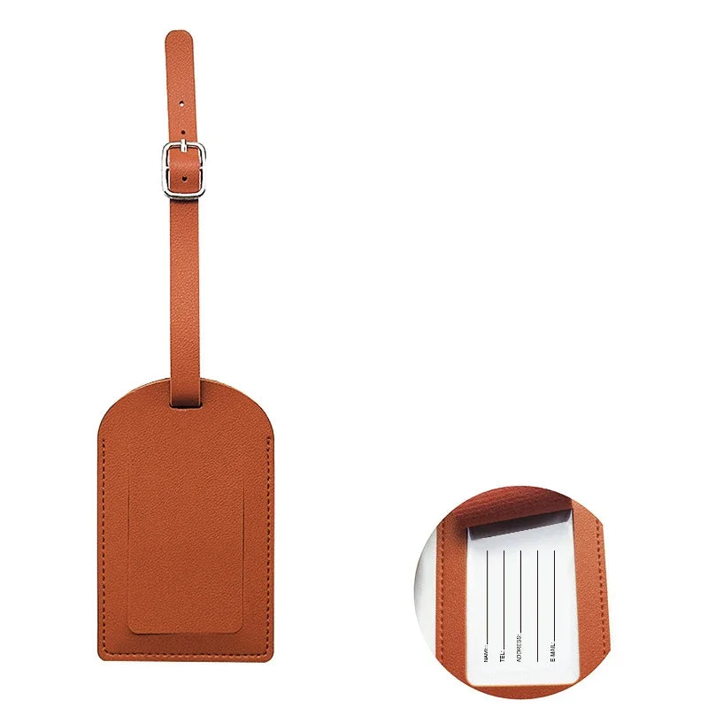 A brown PU leather luggage tag with a metal clip and an ID card holder slot.