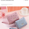A pink and blue PU leather wallet is shown next to a rose on a light pink background.