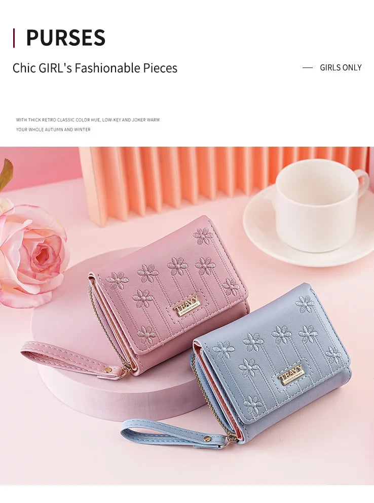 A pink and blue PU leather wallet is shown next to a rose on a light pink background.