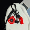A red fitness keychain with a bottle attached, featuring a D-shape nylon design.