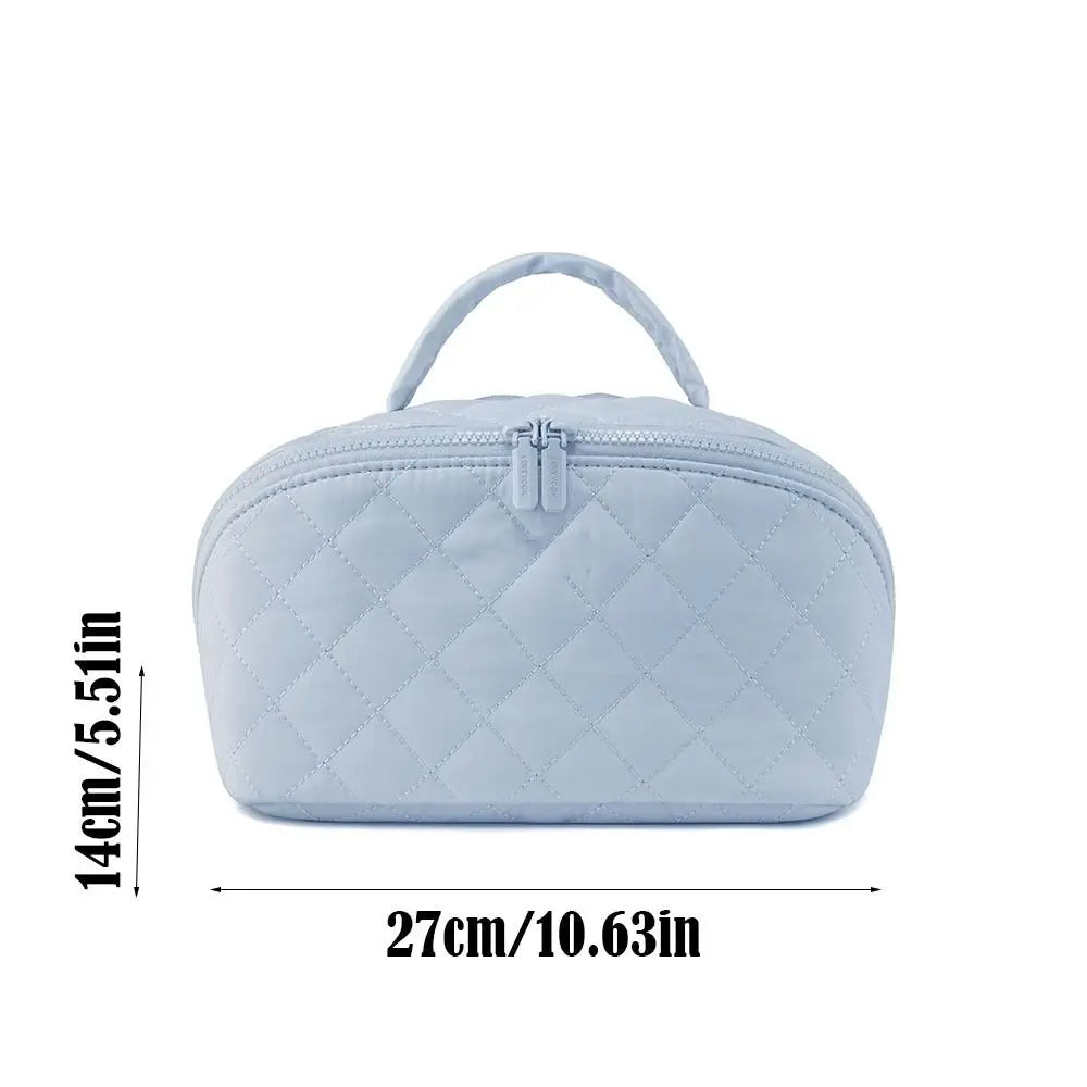 Light blue lay-flat water-resistant makeup organizer bag with a quilted texture