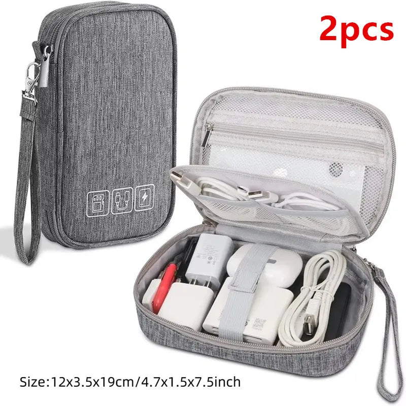 Gray portable digital organizer storage pouch with a clear zippered case containing multiple electronic accessories