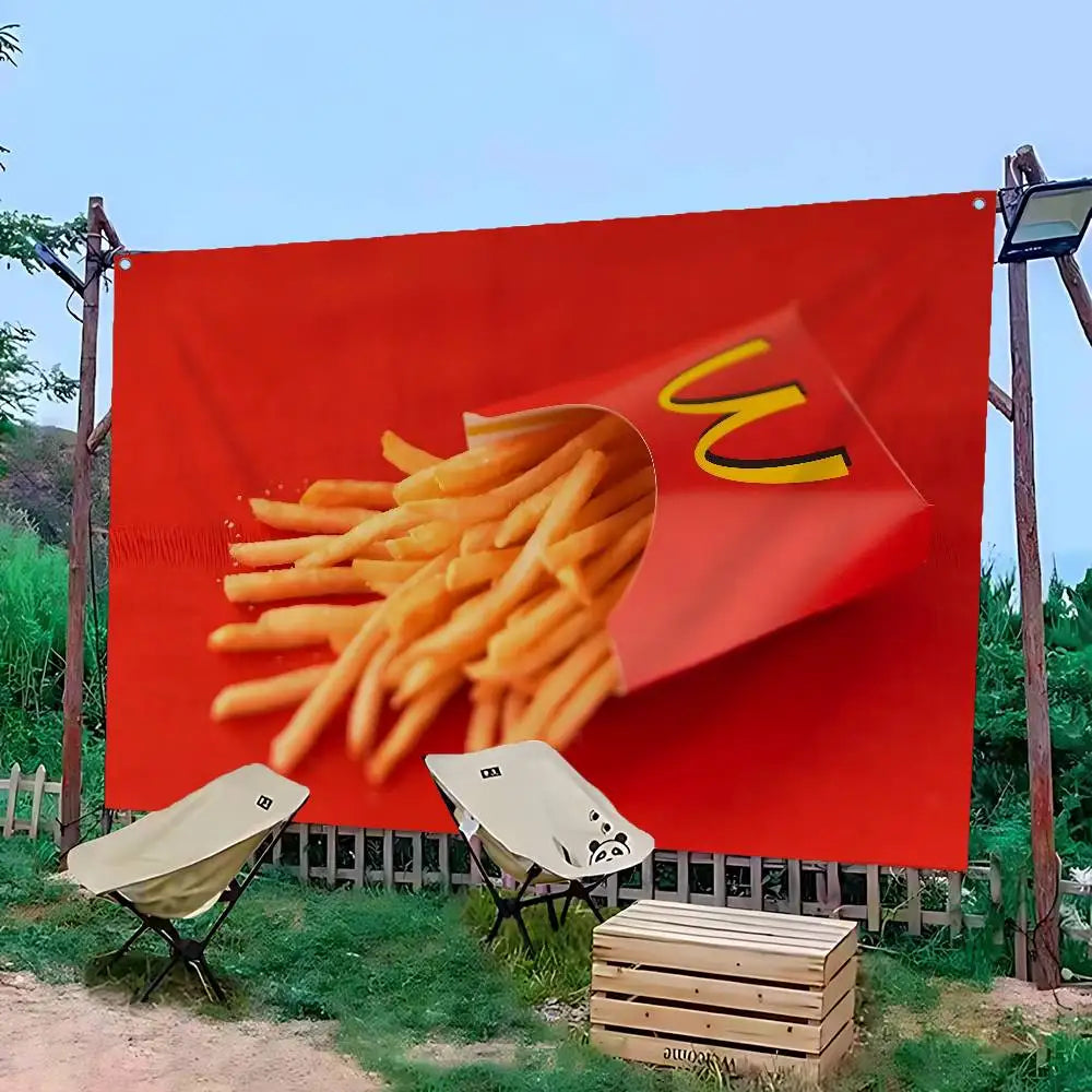 A large red banner featuring a graphic of french fries, displayed outdoors.