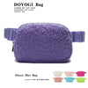 Purple fleece belt bag with a light purple color and a lavender strap.