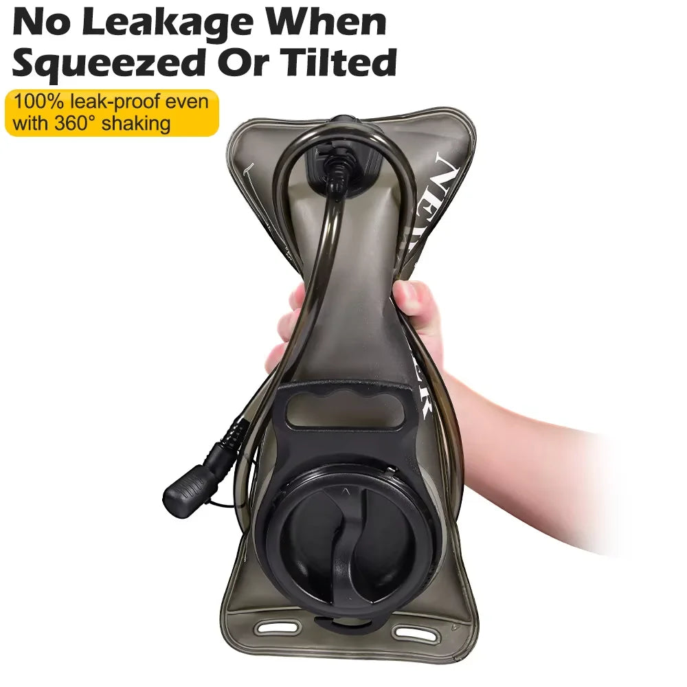 A hand is squeezing a reusable insulated water bladder hydration bottle designed to be leak-proof.