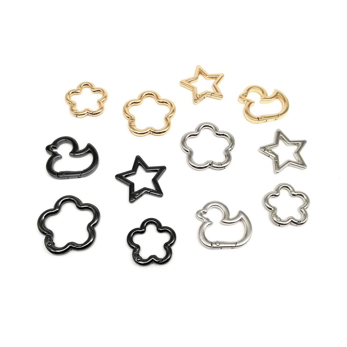 Collection de clips carabine en forme d'étoile, canard et fleur, en or et argent.