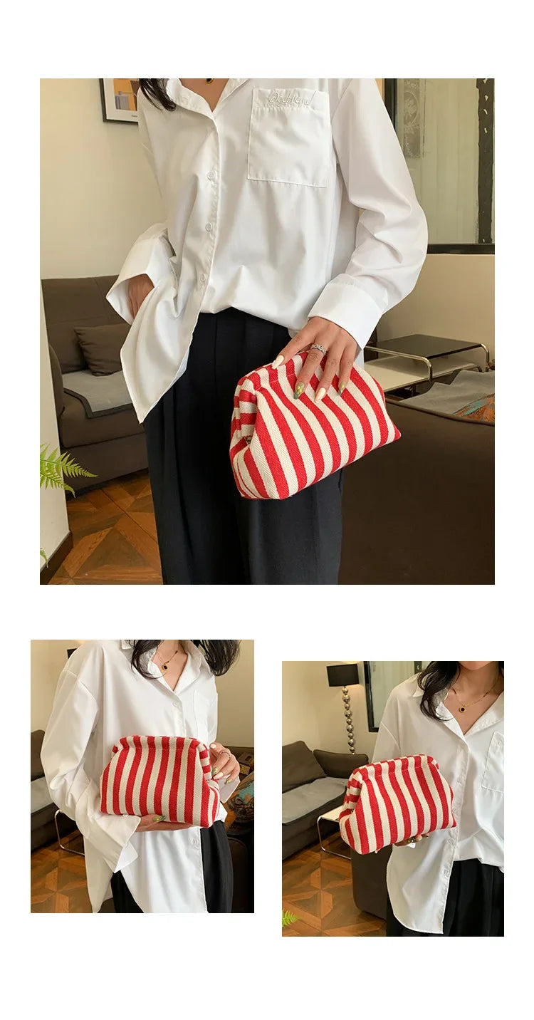 A woman holds a red and white striped crochet tote bag with a shell accent against a dark background.