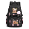 Black canvas backpack featuring a cute capybara print with a pink pom-pom charm