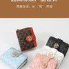 A collection of vintage letter print compact wallets in various colors including brown, orange, black, and pink.