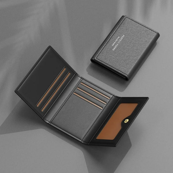A black leather multi-card purse is shown open, displaying a card slot and a small gold-colored detail.