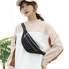 A woman models an adjustable nylon crossbody sling bag in black and beige tones.