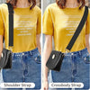 A woman models a black leather crossbody strap attached to a small black bag against a yellow t-shirt and denim jeans.