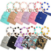 A collection of silicone bead and leather card wallets in various colors and patterns.