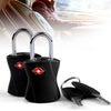 A black keyed luggage lock with a red diamond design and a key lying next to it.