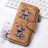 A brown leather zipper wallet featuring a small, fluffy puppy with flowers printed on it.
