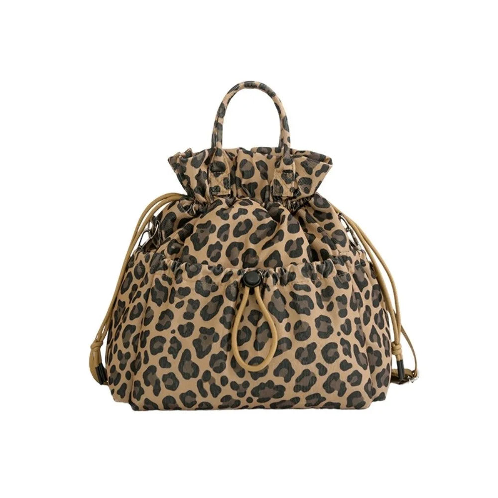 A brown leopard print insulated waterproof lunch bag with a drawstring closure.