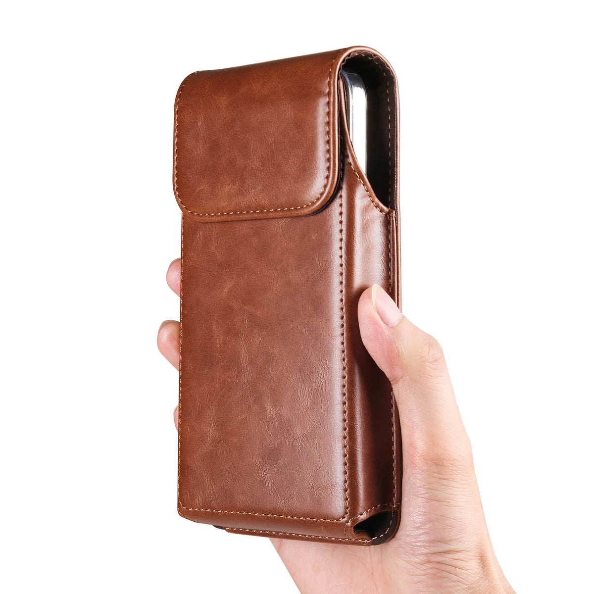A hand holds a brown leather belt loop phone case for an iPhone.